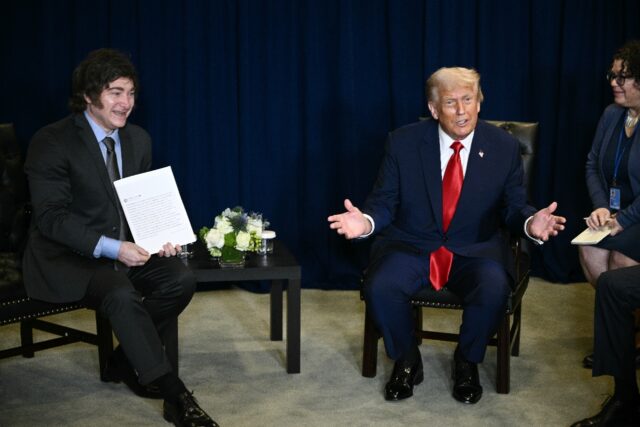 US President Donald Trump (seated R) holds a bilateral meeting with Argentinian President
