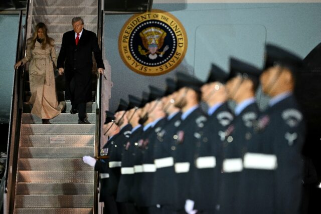 US President Donald Trump and US First Lady Melania Trump disembark from Air Force One at