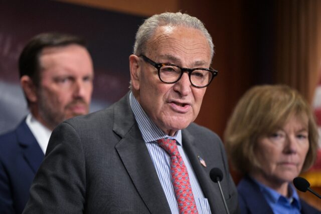 US Senate Minority Leader Chuck Schumer (C) and Senator Chris Murphy (L) say they will int