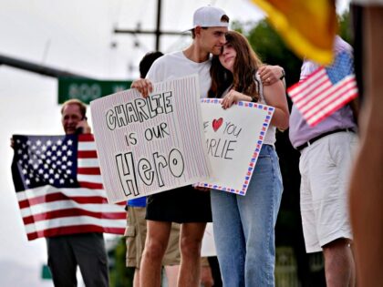 (Francisco Kjolseth | The Salt Lake Tribune) Seth and Jenny Hamby embrace as they gather g