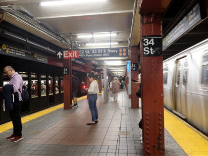 NEW YORK, NY - APRIL 29: People wait to board a yellow line train at the Herald Square - 3