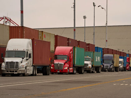 Title: Trump Tariffs Image ID: 25214073504489 Article: Trucks wait in line outside before