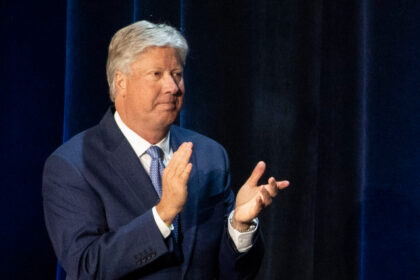 FILE - Pastor Robert Morris applauds during a roundtable discussion at Gateway Church Dall