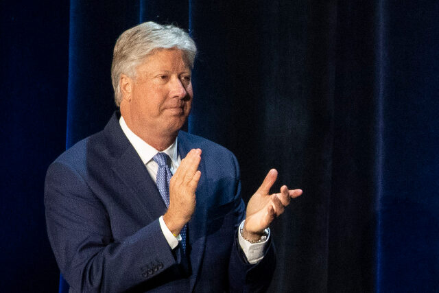 AP25275744876276 (1) FILE - Pastor Robert Morris applauds during a roundtable discussion at Gateway Church Dall
