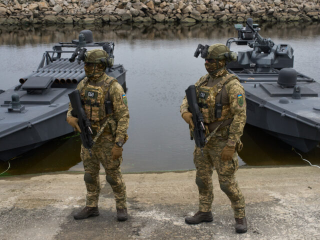 Ukraine's Security Service officers stand by Sea Baby drones, during a demonstration