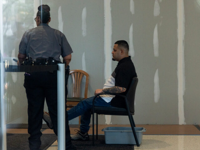Kilmar Abrego Garcia goes through security as he arrives at a U.S. Immigration and Customs