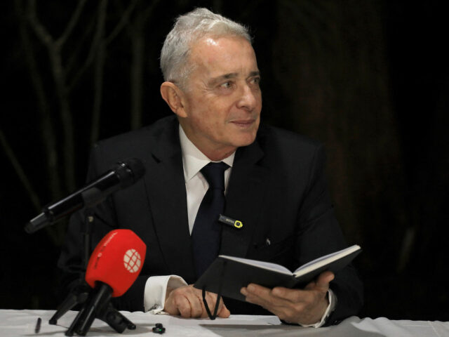 Former Colombian President Alvaro Uribe gestures during a press conference in Rionegro, An