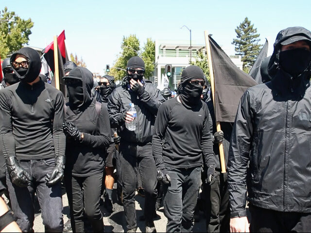 Antifa Members Black-clad Antifa marchers arrive at Civic Center Park, Sunday, Aug. 27, 2017, in a counte