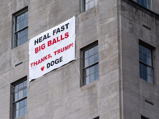 A sign wishes a speedy recovery for former DOGE appointee Edward Coristine, known by his n