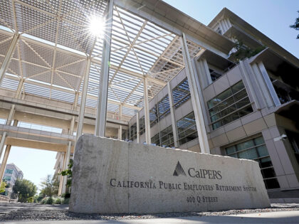 FILE - The suns peaks over the California Public Employees Retirement System's building in