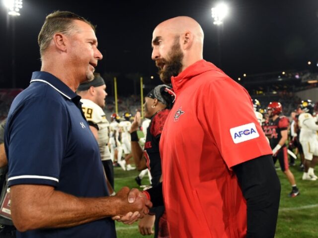 Chris Williams_Icon Sportswire via Getty Images SAN DIEGO, CA - AUGUST 31: Head coach Sean Lewis shakes the hand of Texas A&M-Commerce