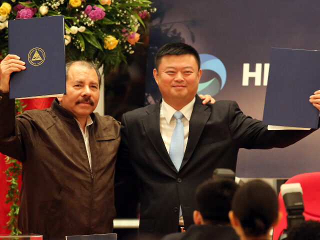 Daniel Ortega China Nicaraguan President Daniel Ortega (L) stands with Wang Jing, president of of the Chinese