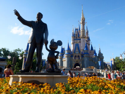 ORLANDO, FL - MAY 31: A statue of Walt Disney and Mickey Mouse stands in a garden in front