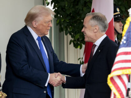 US President Donald Trump, left, and Mark Carney, Canada's prime minister, shake hand