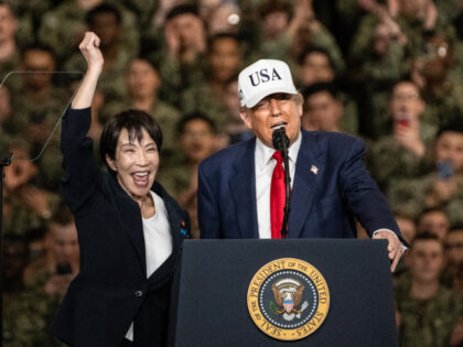 Japan's Prime Minister Takaichi Sanae (L) gestures as US President Donald Trump deliv