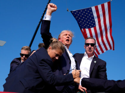 Republican presidential candidate former President Donald Trump is surrounded by U.S. Secr