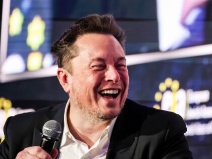 Elon Musk laughing at the left