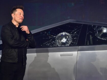 Elon Musk with his busted up Cybertruck