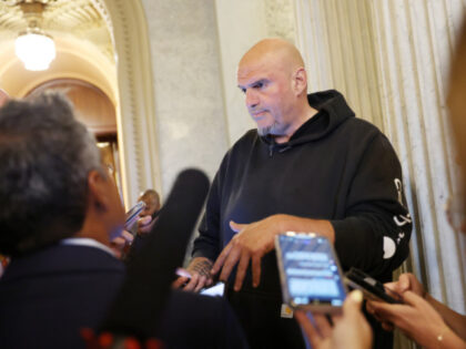 Sen. John Fetterman (D-PA) speaks to reporters in the U.S. Capitol on September 29, 2025 i