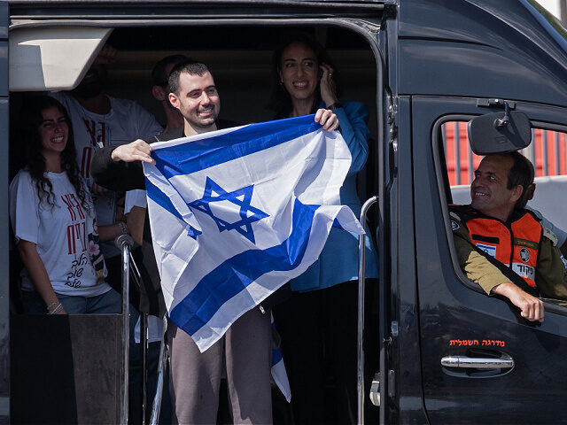 PETAH TIKVA, ISRAEL - OCTOBER 13: Former hostage Guy Gilboa-Dalal waves to supporters outs