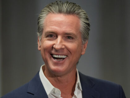 California Gov. Gavin Newsom smiles after signing legislation related to student literacy