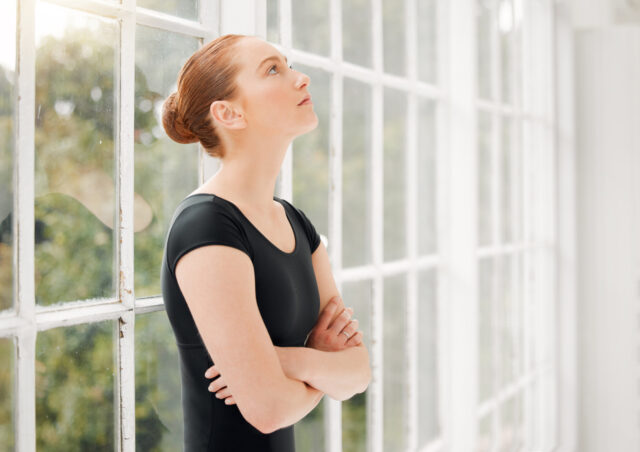 Shot of a ballet dancer standing alone looking nervous and stressed Waiting on some sign