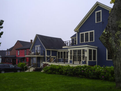 Vibrant buildings and garden in a small town shopping mall in the coastal village of New E