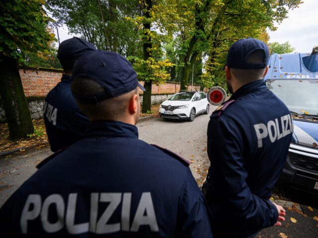 Italian border police controls the traffic on the Slovenian-Italian border crossing in Roz