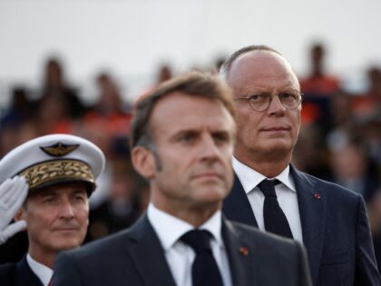 Mayor of Le Havre Edouard Philippe (R) looks towards France's President Emmanuel Macron (C
