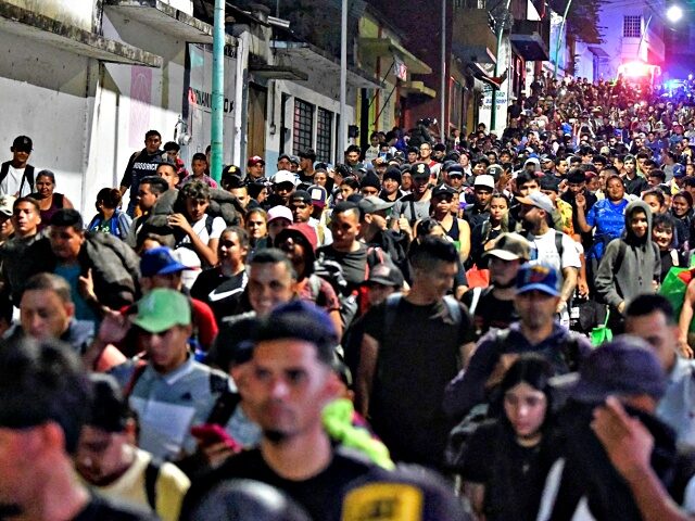 Migrants from a caravan in Tapachula, Chiapas state, Mexico, march while heading to the US