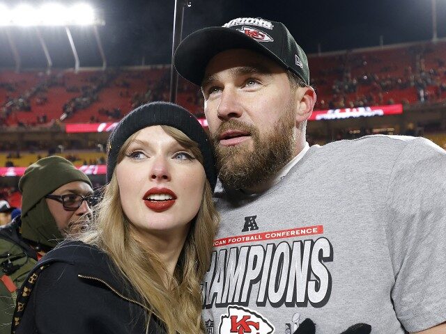 Taylor Swift celebrates with Travis Kelce #87 of the Kansas City Chiefs after defeating th