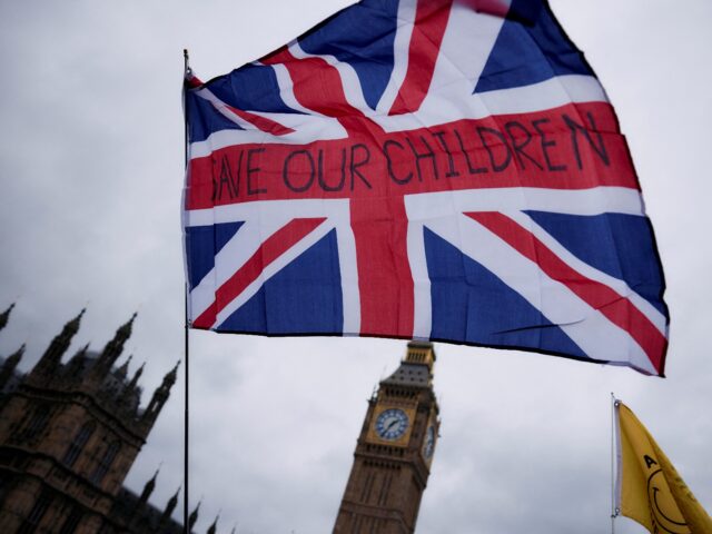 TOPSHOT - Supporters of Britain's notorious anti-Muslim agitator, Stephen Yaxley-Lennon, a