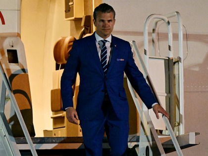 US Secretary of Defense Pete Hegseth walks down a plane upon arrival at Panama Pacifico In