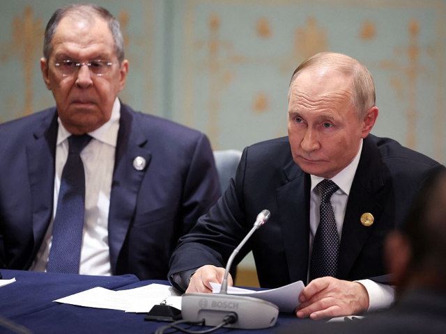 In this pool photograph distributed by the Russian state agency Sputnik, Russia's Presiden