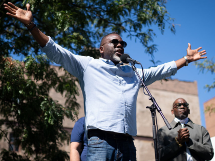 CHICAGO, ILLINOIS - SEPTEMBER 1: Chicago Mayor Brandon Johnson speaks to the crowd while p