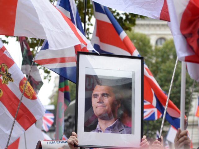 LONDON, ENGLAND - SEPTEMBER 13: Protesters hold tributes to Charlie Kirk during their marc