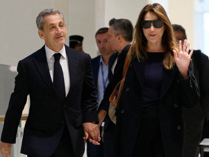 Former French president Nicolas Sarkozy with his wife Carla Bruni arrives for the verdict