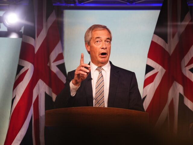 Reform UK leader Nigel Farage reacts to the speech by Prime Minister Sir Keir Starmer at t