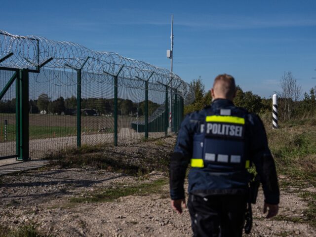 VINSKI, ESTONIA - OCTOBER 1: An Estonian border police officer re-enters a gate in a secur