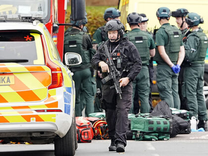An armed police officer at the scene of an incident at Heaton Park Hebrew Congregation syn