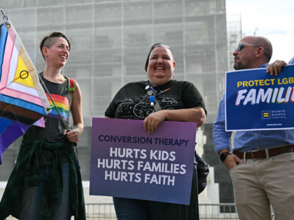 Demonstrators protest against conversion therapy outside the US Supreme Court as the Court
