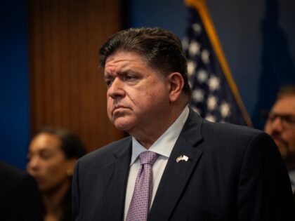 Gov. JB Pritzker stands with other elected officials to discuss federal deployments in Chi