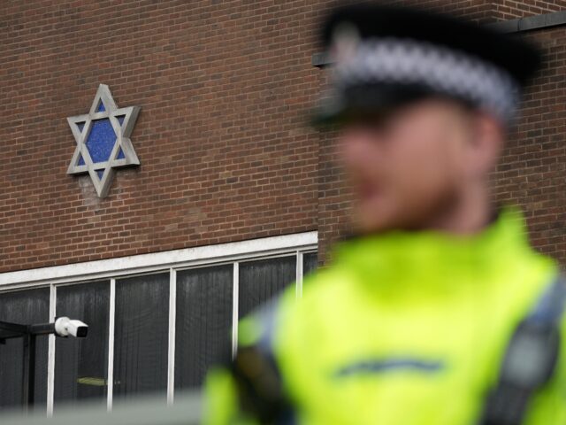 MANCHESTER, ENGLAND - OCTOBER 05: A policeman guards the outside of Heaton Park Hebrew Con