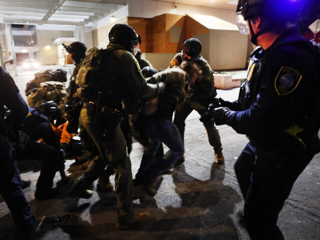GettyImages-2239485852 (1) PORTLAND, OREGON - OCTOBER 05: Federal agents, including members of the Department of Home