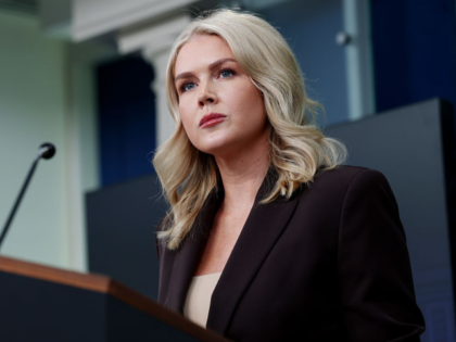 WASHINGTON, DC - OCTOBER 06: White House Press Secretary Karoline Leavitt (R) speaks durin