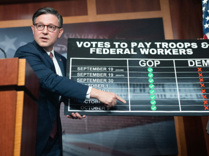 UNITED STATES - OCTOBER 10: Speaker of the House Mike Johnson, R-La., holds up a chart abo
