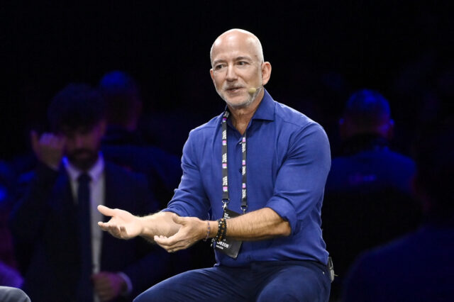 TURIN, ITALY - OCTOBER 3: Jeff Bezos Amazon's founder speaks with John Elkann Stellan