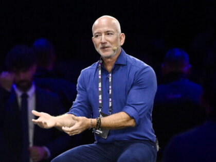 TURIN, ITALY - OCTOBER 3: Jeff Bezos Amazon's founder speaks with John Elkann Stellan