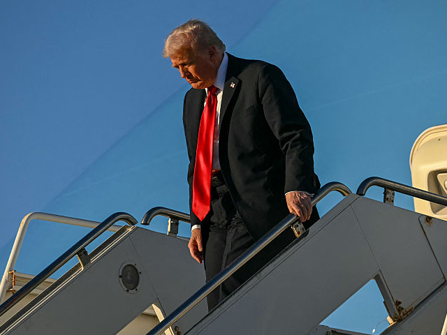 GettyImages-2240439481 TOPSHOT - US President Donald Trump disembarks from the Air Force One upon his arrival at