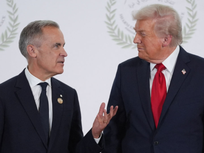 US President Donald Trump greets Canada's Prime Minister Mark Carney during a summit on Ga